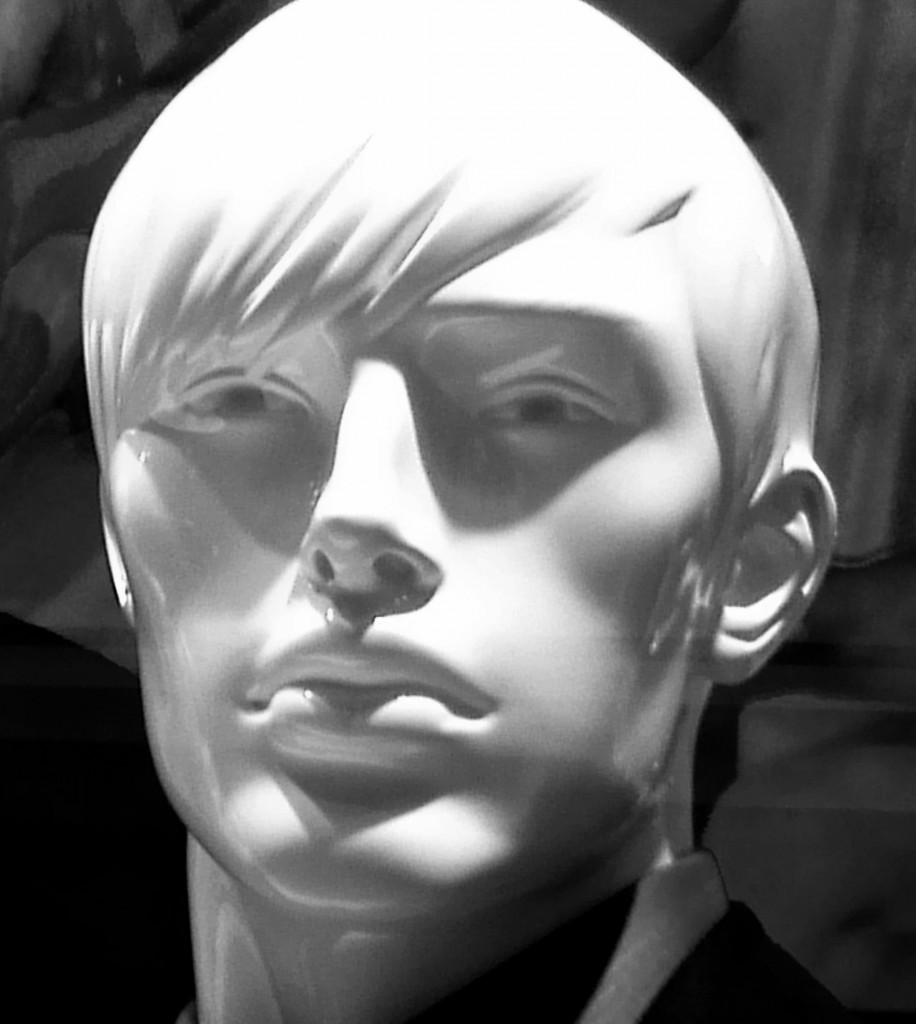 black and white photo of a male mannequin