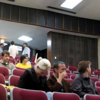 Busy lecture hall, with Cory Doctorow nestled in the audience